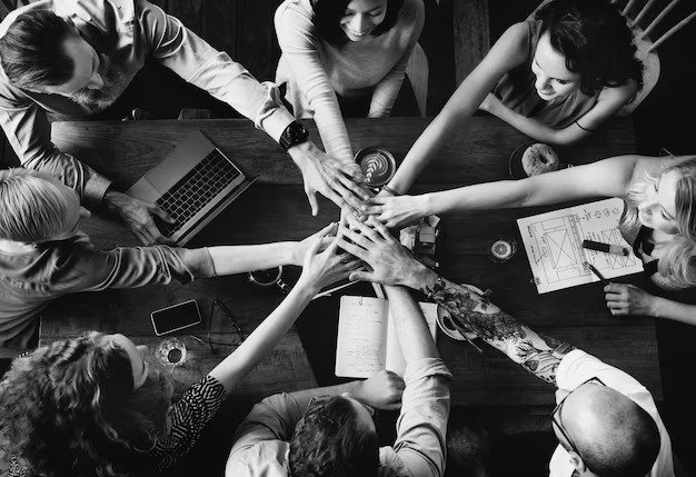 group diverse people with joining hands teamwork